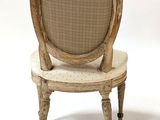 a chair that is sitting on a white surface