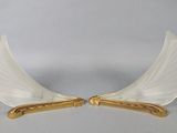 pair of white and gold angel wings on a white background