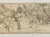 une vieille carte du monde avec un point rouge au milieu