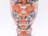 a vase with a design on it on a white background