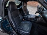 an image of a car with the door open and the seat up