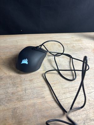 a computer mouse that is sitting on a wooden table