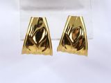 a pair of gold plated earrings on a white background