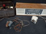 an old radio sitting on the floor next to other electronics
