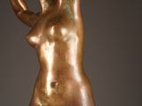 sculpture of a female nude torso and hands on a marble base