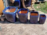 many pots that are sitting on the ground