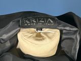a close up of a black jacket with a label on it