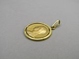 a close up of a gold coin with a bird on it