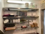 a kitchen with a lot of items on the shelves