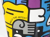 a cup with a colorful design on it that says believe the artist