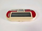 a red and white electronic device on a white surface