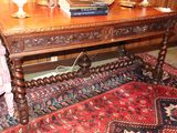 a wooden table with a book on top of it