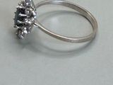 an image of a ring with a black diamond in it