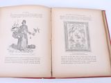 an open book with a picture of a man and a dog