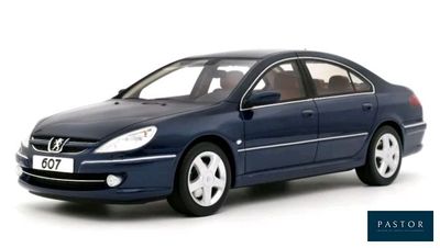 the blue car is parked on the white surface with a white background