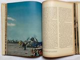 an open book with a picture of a plane on it