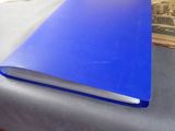 a blue book sitting on top of a table