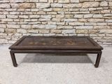 an image of a coffee table sitting on top of a cement floor