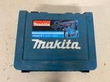 a close up of a blue tool box with a hammer on top of it