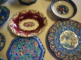 many plates and bowls on the table together