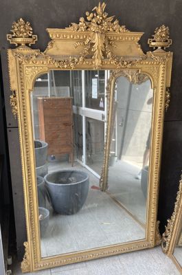 two mirrors sitting next to each other on the floor