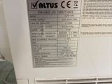 a close up of a white air conditioner sitting on top of a floor