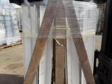a pallet with a lot of different types of speakers on it