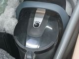 a vacuum that is sitting inside of a box