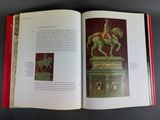 an open book with a picture of a statue of a man on a horse and a statue of a man on a horse