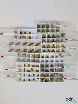 a lot of different types of nuts in a plastic box