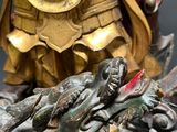 a statue of a man and a dragon on a table