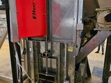 a machine that has a red door in the middle of it