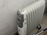 an image of a radiator that is on the ground next to a wall