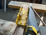a saw that is sitting on top of a piece of wood