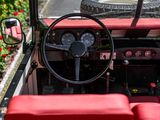 a red and black car with a steering wheel and dashboard