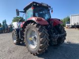 a picture of a tractor that is parked in a lot