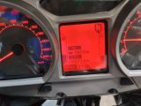 a close up of a speedometer and gauge on a motorcycle