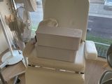 a chair that has a box on top of it