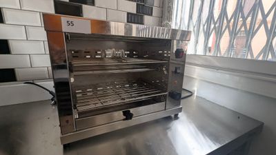 a toaster oven sitting on a counter in a kitchen