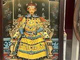 an image of a statue of a man sitting on a throne