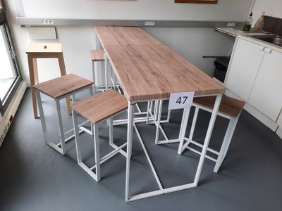 four stools sitting at a table in a kitchen