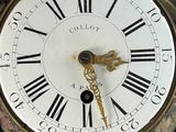 a close up of a clock with roman numerals on it