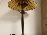 a lamp that is sitting on top of a microwave