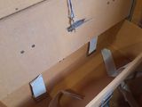 a cardboard box with a pair of scissors inside of it