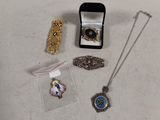 a lot of jewelry that is sitting on a table