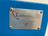 a close up of a metal plate on a blue suitcase