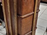 a wooden cabinet with a glass top in a store