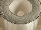 a roll of aluminum foil sitting on the floor