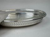 a silver tray with a silver lid on a table