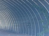 an image of a man riding a skateboard in a tunnel